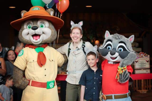 Jaime and Cale Teevan hug Great Wolf characters after their 100-mile walk