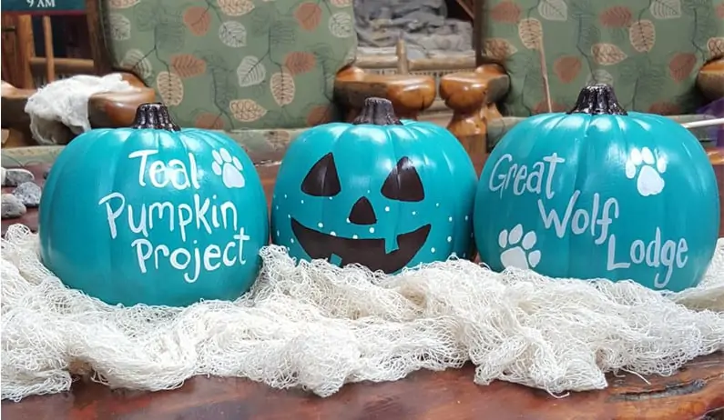 Three pumpkins painted blue