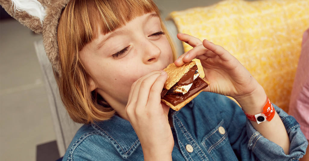 girl eating smores