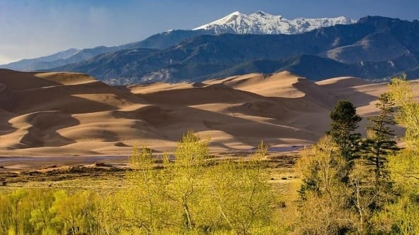 Sprawling sand dunes and mountain views at one of Colorado’s national parks