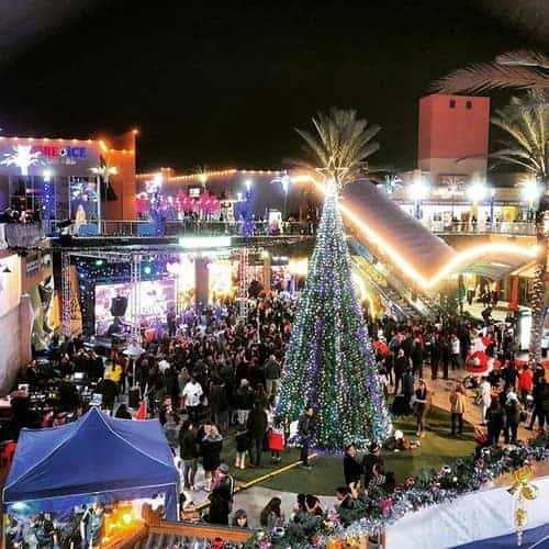 View of the crowd at Anaheim Garden Walk at night during Christmas