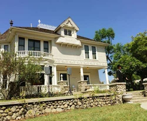 View of an old colonial house and reenactment actor of Abraham Lincoln at the Heritage Center in Orange County