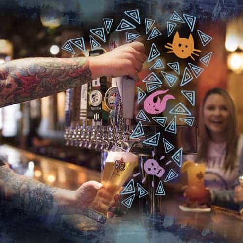 Bar tender pouring beer from the tap into a pint glass at the House of Blues in Anaheim