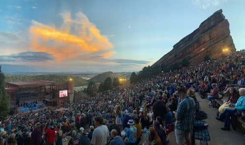 Concert-goers enjoying a show at the Red Rocks Amphitheatre in Denver