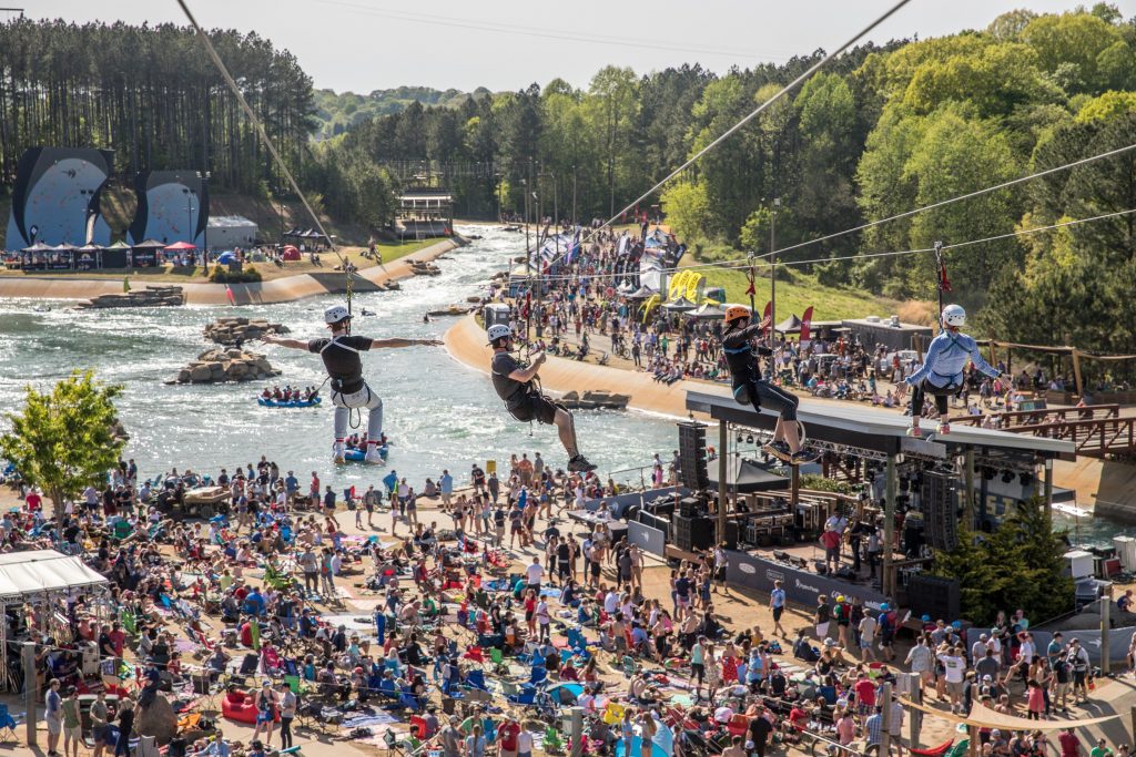 A crowd gathers on a nice day at the National Whitewater Center in North Carolina