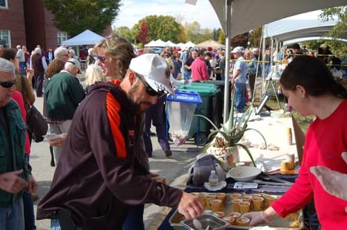 Women serving New England Clam Chowder at Chowdafest in Massachusetts