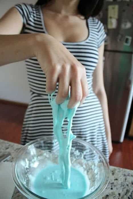 Woman playing with homemade goop