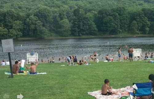 Visitors enjoying Milford Beach in the Poconos