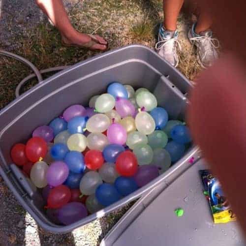 Water balloons in plastic container
