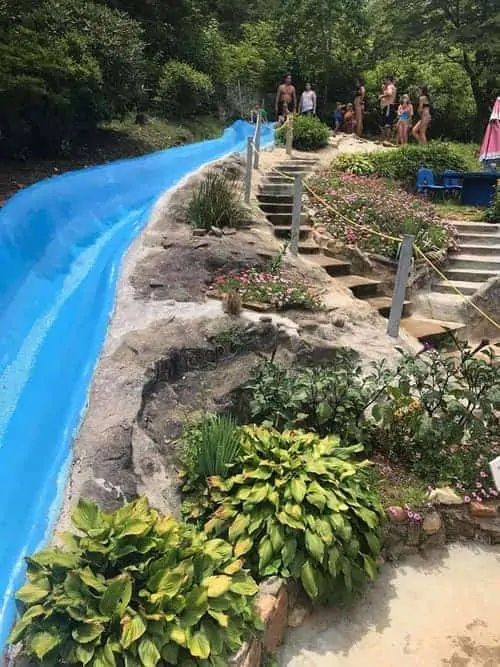 water slide next to garden