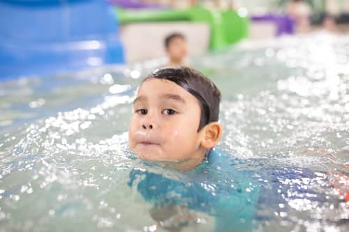 kid swimming at great wolf lodge in georgia