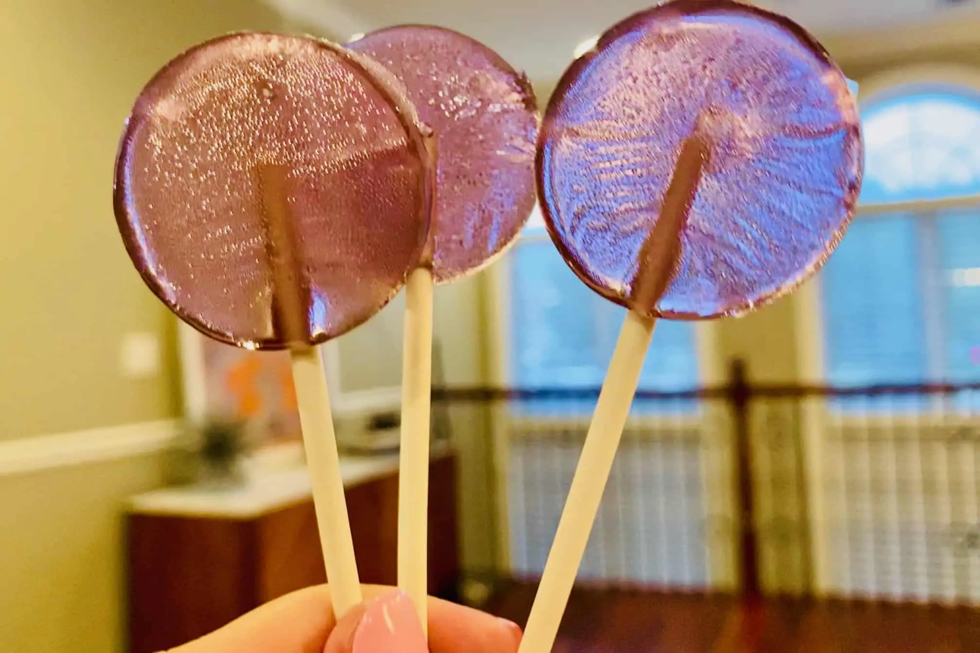 three bubble shaped lollipops