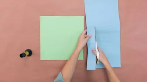 se your ruler to measure ½ inch on the blue construction paper. Cut ½ strips of blue construction paper