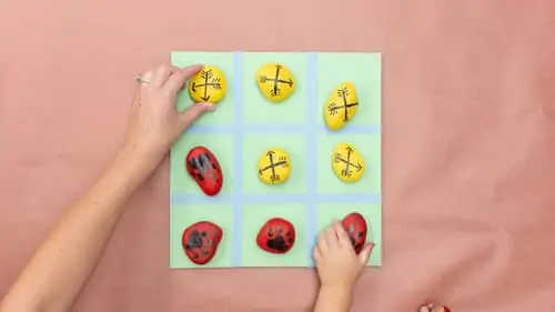 place painted rocks on DIY gameboard