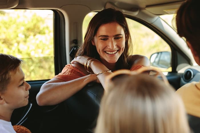 Happy young family going on road trip