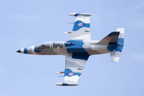 a plane flying at the olympic flight museum