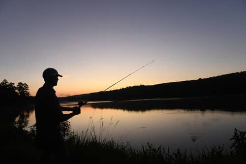 A man fishing at the pine mountain 