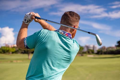 a man playing golf at the airport golf and batting cage tumwater