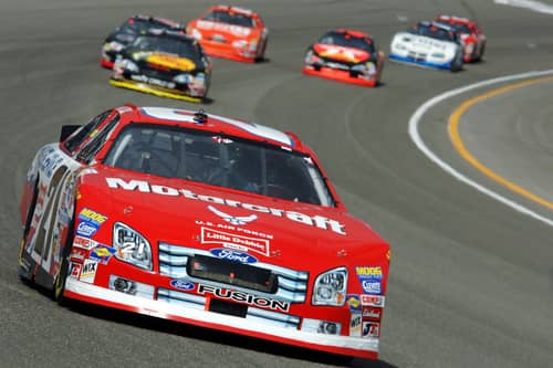 cars driving on the race course at rusty wallace racing experience