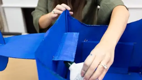 cutting a slit in the box