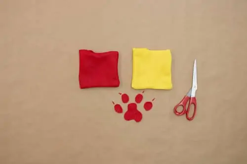 red felt square, yellow felt square, red paw print and scissor