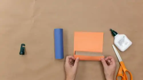 rolling craft roll in orange construction paper