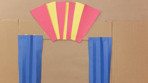 theater out of blue, yellow and red construction paper and cardboard box