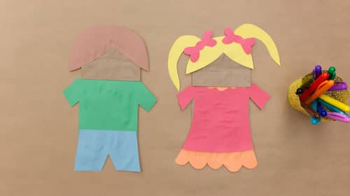 make puppets out of paper bag and colored construction paper