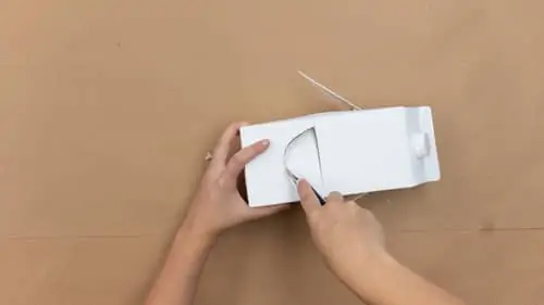 cut half moon mouth into milk carton