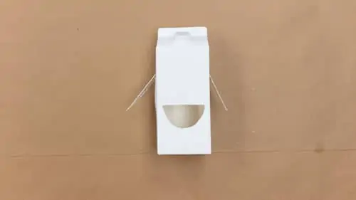 cut small hole into milk carton