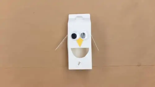 glue googly eyes onto milk carton