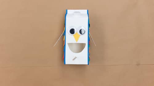 attach blue craft foam to milk carton