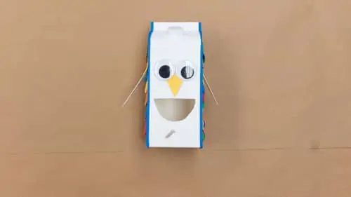 attach blue craft foam to milk carton