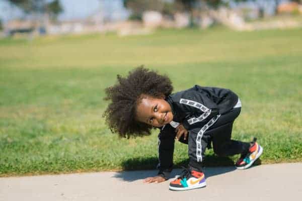 little girl running outside