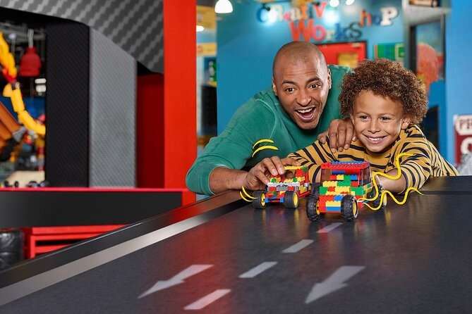 a father with his child playing at LEGOLAND  Discovery Center