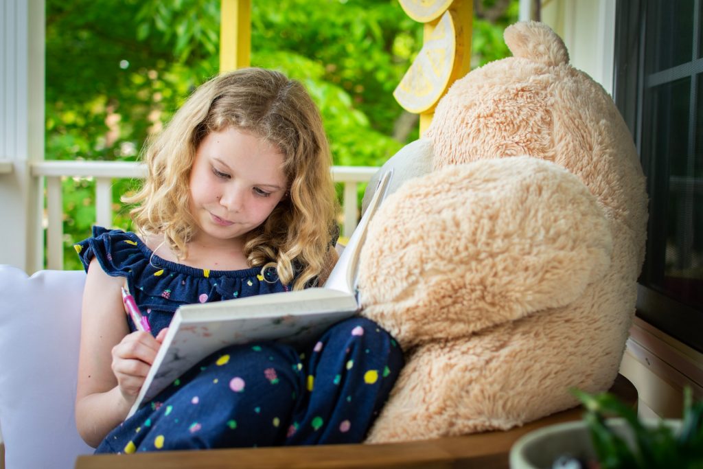 girl writing in notebook