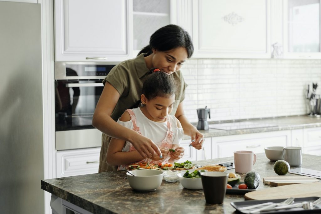 Mother and child cooking in the kitchen