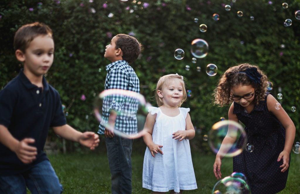 kids playing with bubbles