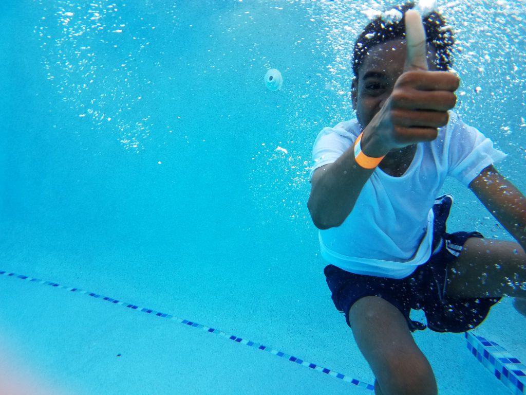 kid swimming underwater