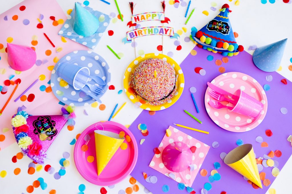 table with birthday cake and decorations