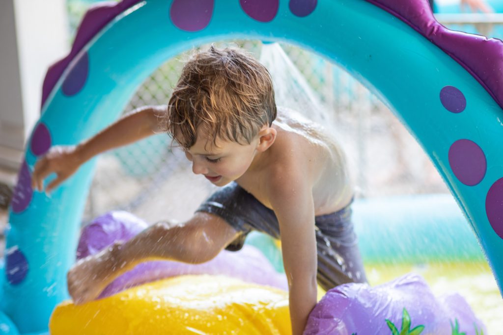 kid playing in pool