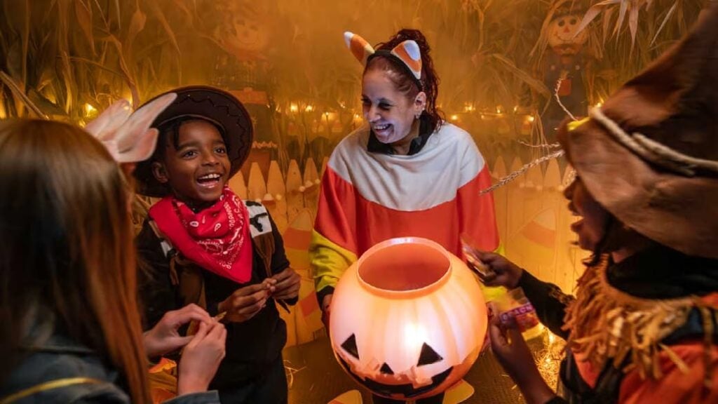 Woman at Great Wolf Lodge and kids trick or treating