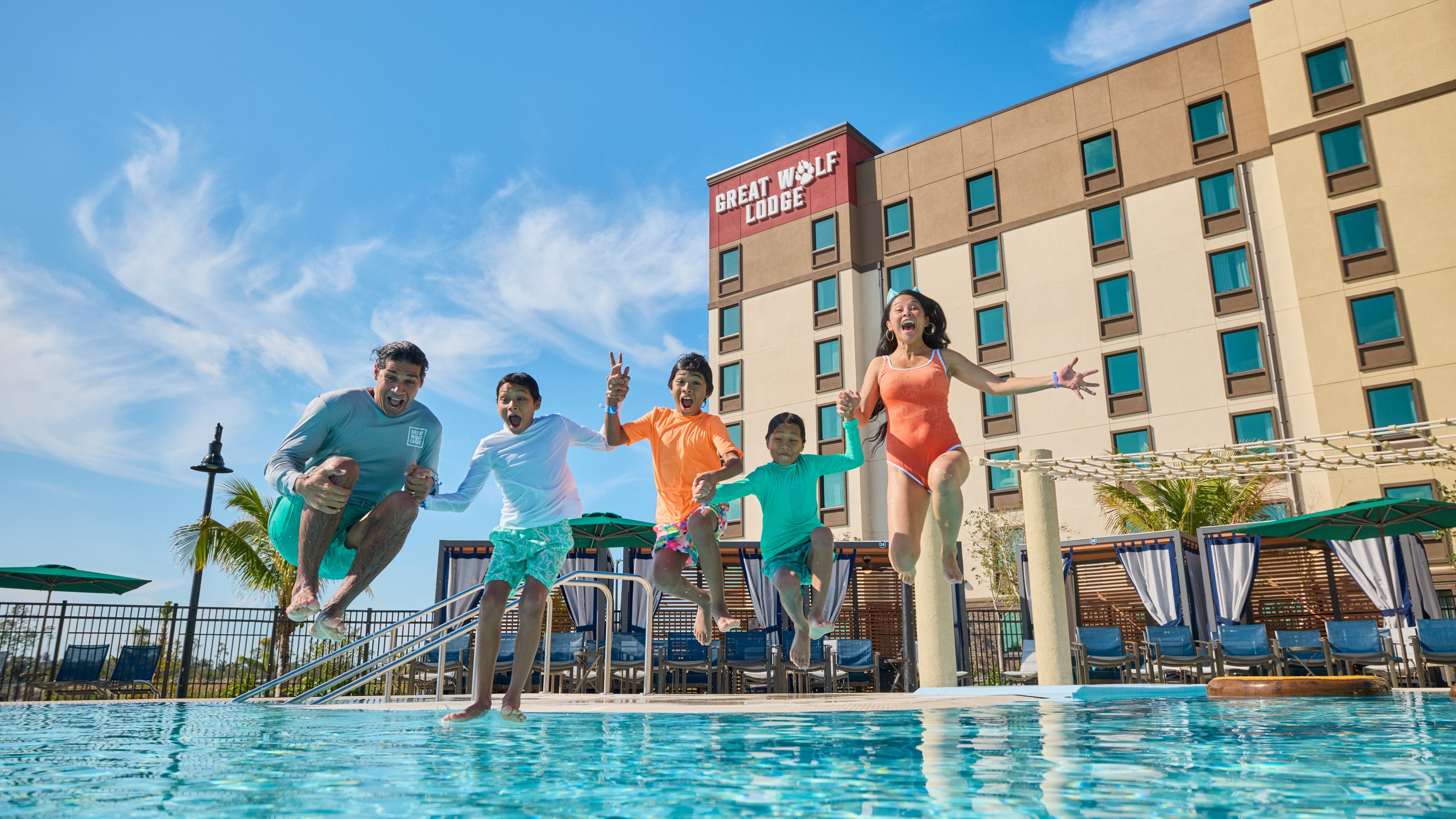 kids jumping into the pool