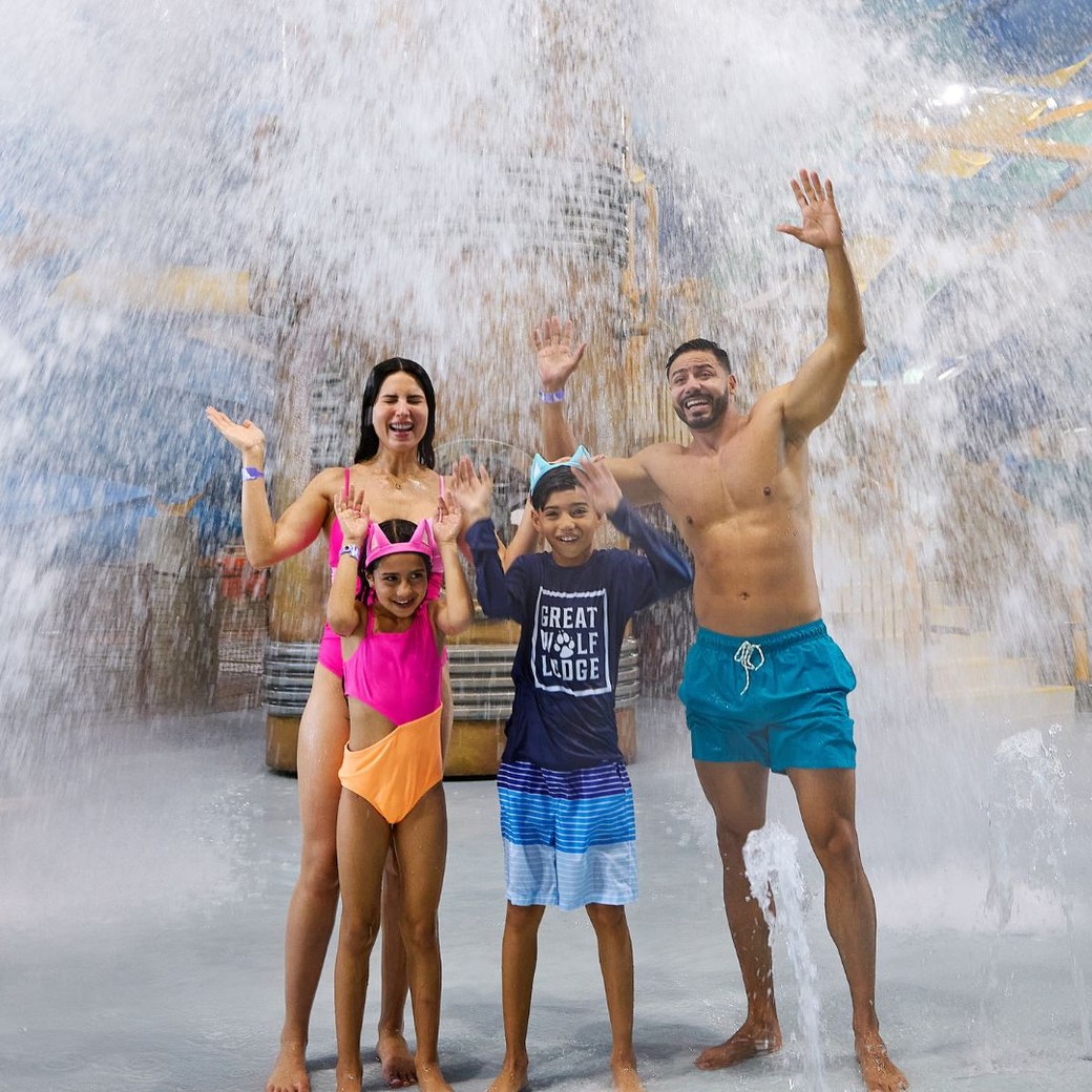 Family of four enjoying the water park