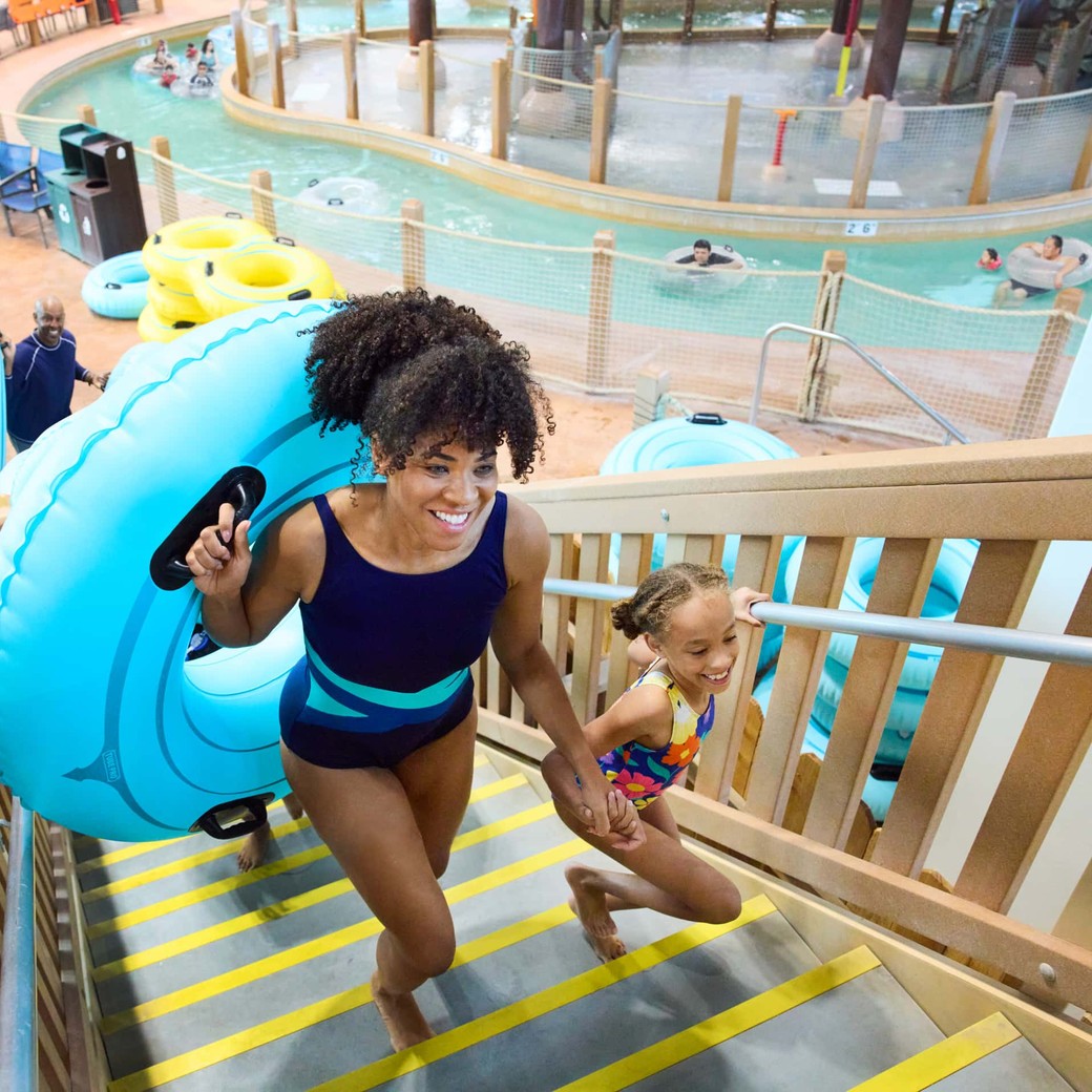 Children playing on colorful pool toy at Great Wolf Lodge.