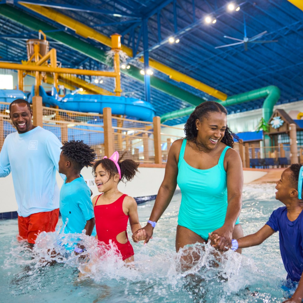 family enjoying in the pool at a waterpark