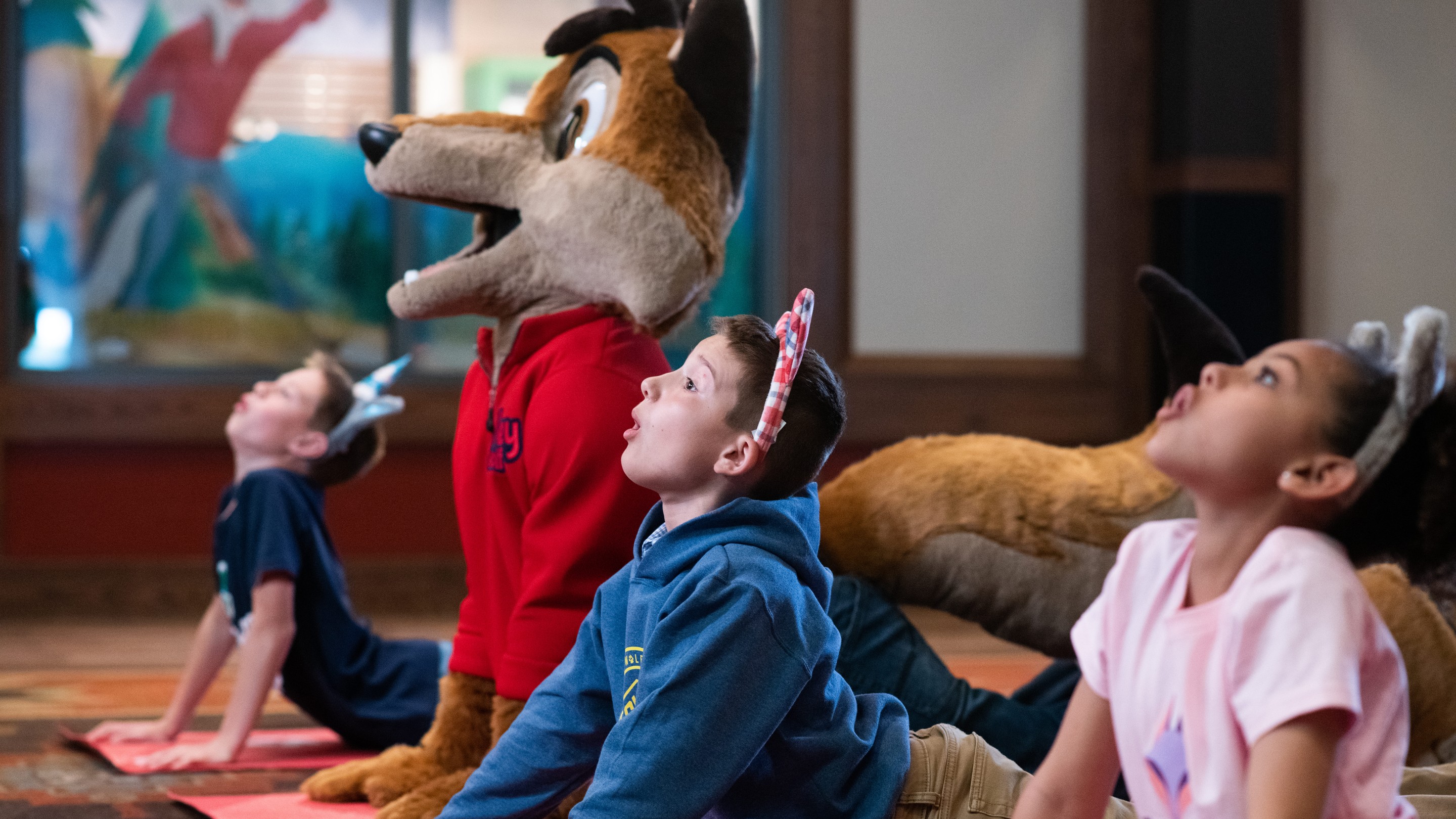 children doing yoga with great wolf lodge characters