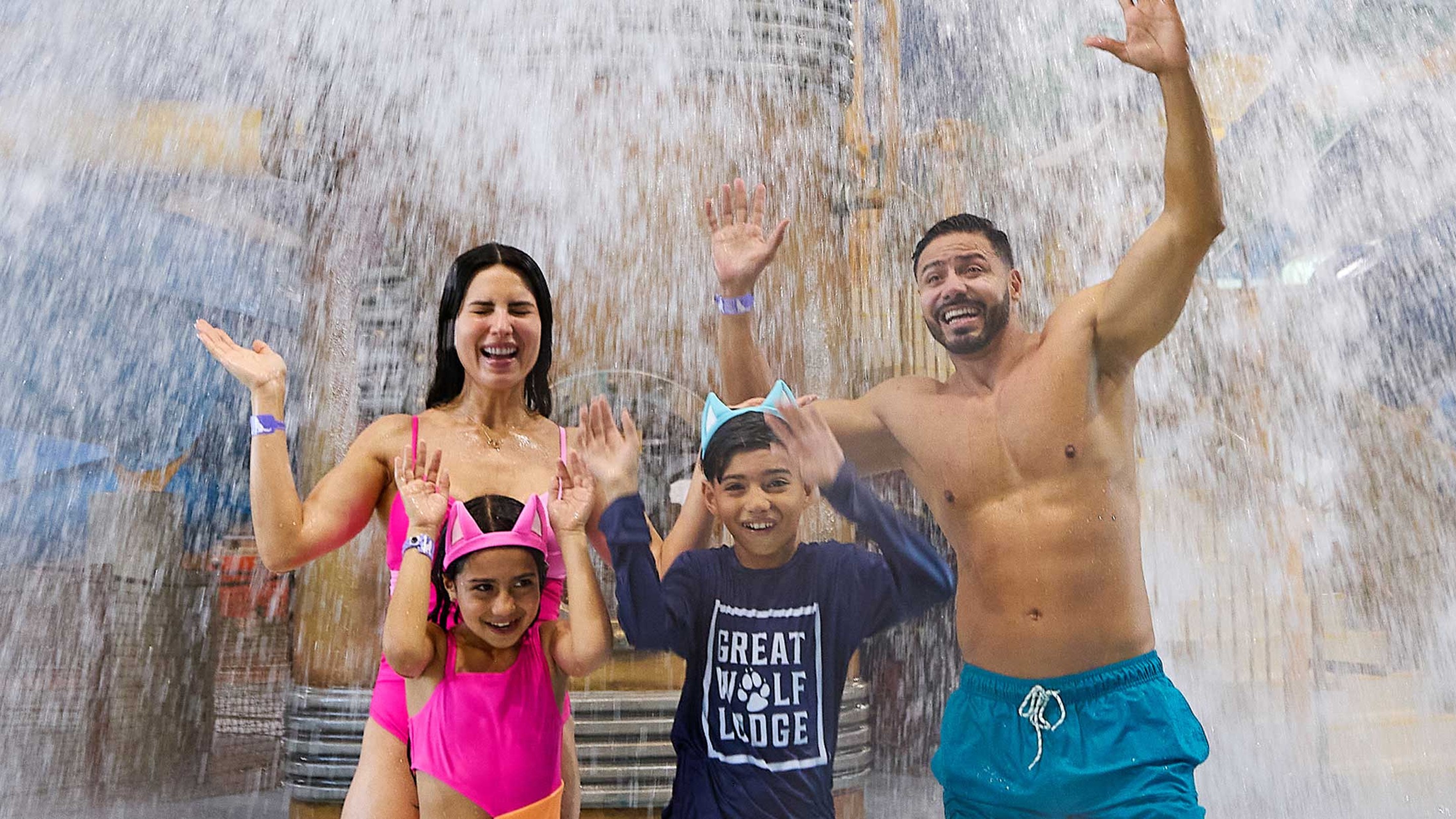 family getting splashed by the tipping bucket