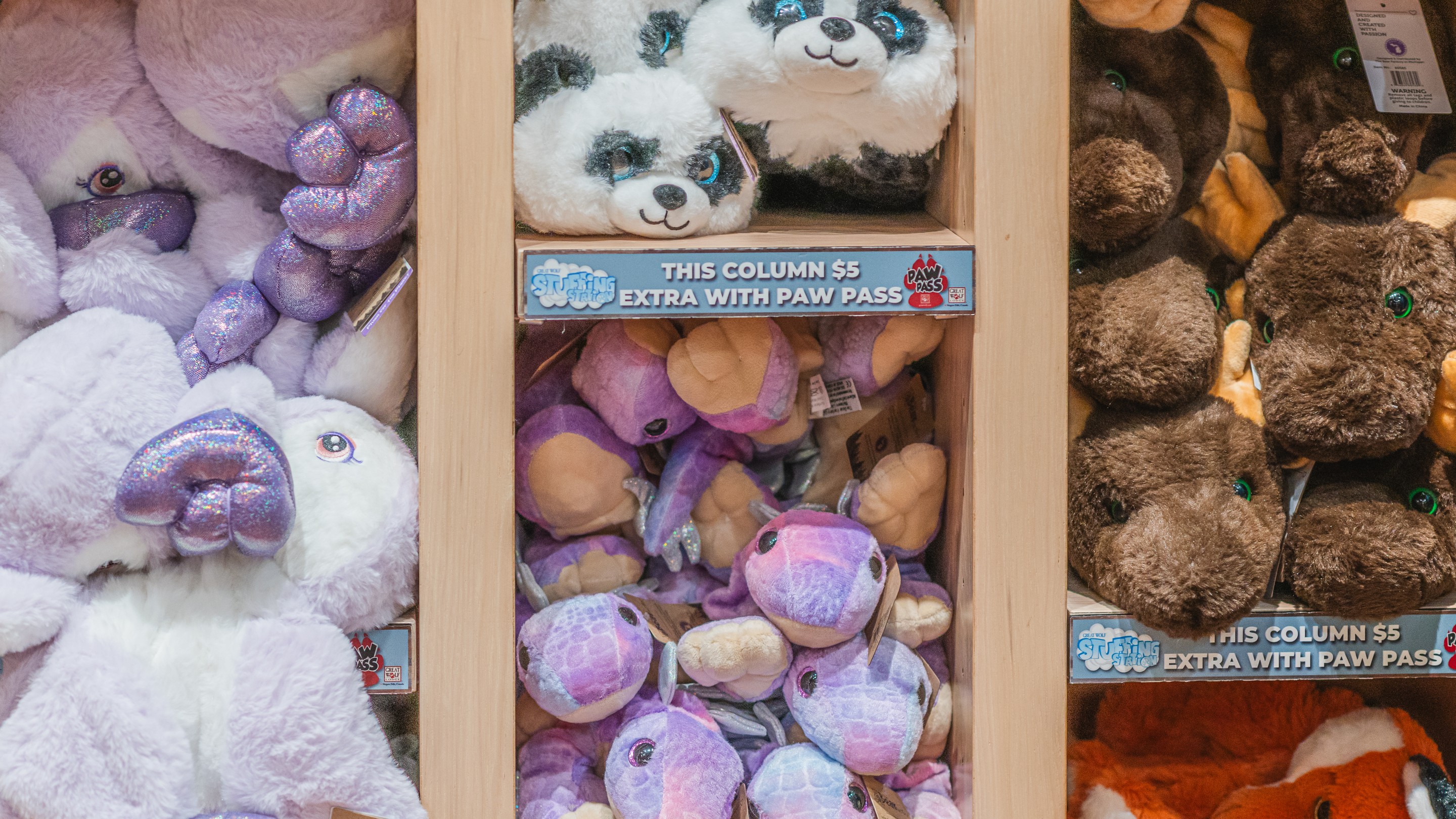 father and daughter looking at stuffed toys 