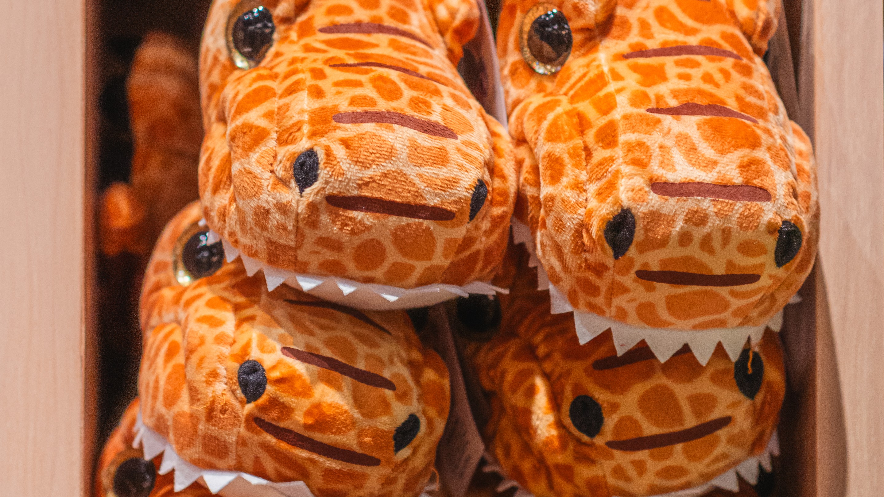 mother watches as a child hugs a stuff toy